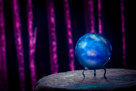 Magic crystal ball on a tableの写真素材