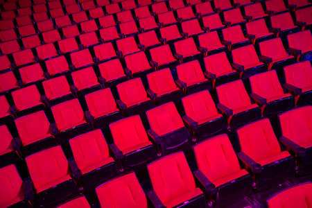 Empty rows of red theater or movie seatsの写真素材