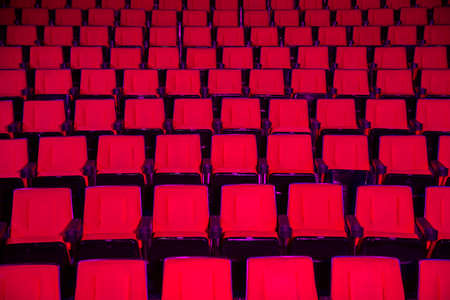 Empty rows of red theater or movie seatsの写真素材