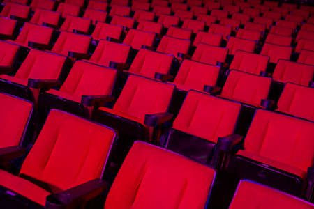 Empty rows of red theater or movie seatsの写真素材