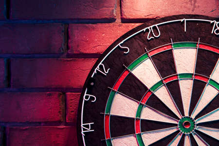 dartboard on a brick wallの写真素材