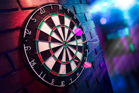 dartboard on a brick wall