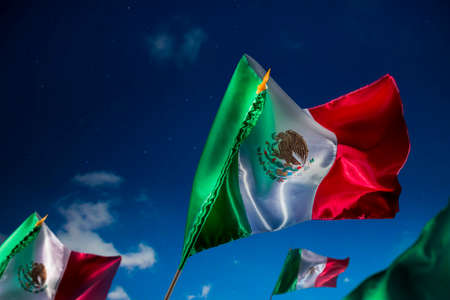 Mexican Flags with dramatic lighting, Independence day, cinco de mayo celebrationの写真素材