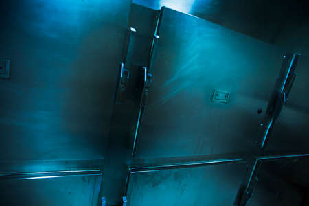 Grungy and high contrast photo of morgue traysの写真素材