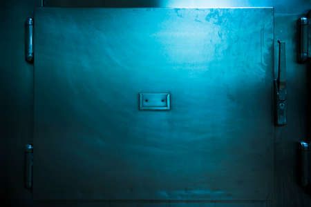 Grungy and high contrast photo of morgue traysの写真素材