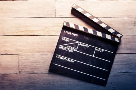 vintage photo of movie clapper on woodの写真素材