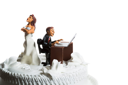 angry bride because her husband doesn't leave the computer alone.の写真素材