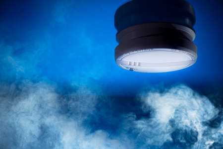 smoke detector on a blue backgroundの写真素材