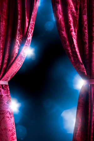 Theater curtain with dramatic lighting and lens flareの写真素材