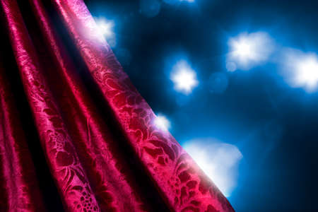 Theater curtain with dramatic lighting and lens flareの写真素材