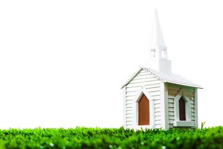 isolated white chapel on grassの写真素材