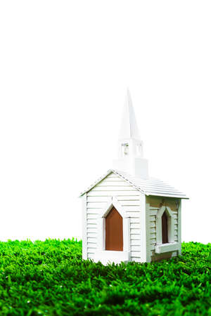 isolated white chapel on grassの写真素材