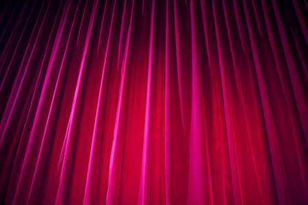 Theater curtain with dramatic lightingの写真素材
