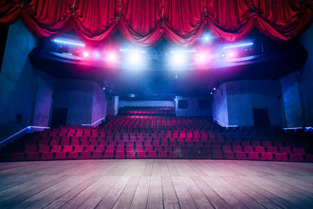 Theater curtain and stage with dramatic lightingの写真素材