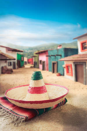 Mexican hat "sombrero" on a "serape" in a mexican townの写真素材