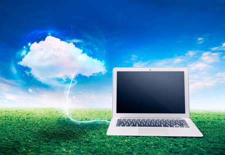 laptop on grass, cloud computing conceptの写真素材