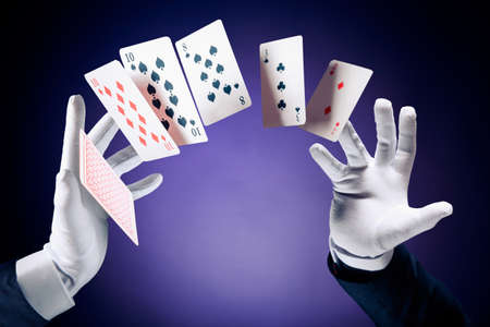 Magician hands with magic cardsの写真素材