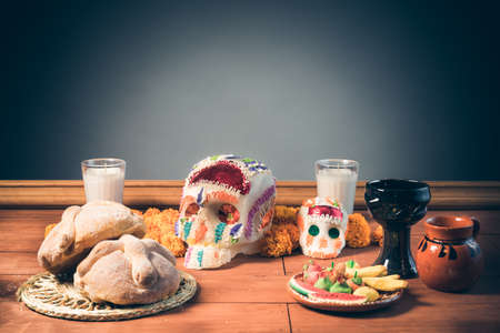 High contrast image of sugar skull used for "dia de los muertos" celebration in a grey backgroundの写真素材