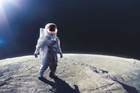 Astronaut standing on the moonの写真素材