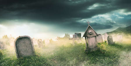 graveyard with fog with dramatic lightingの写真素材