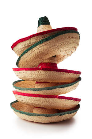 Mexican hats or "sombreros" stacked up on top of each other, isolated on whiteの写真素材