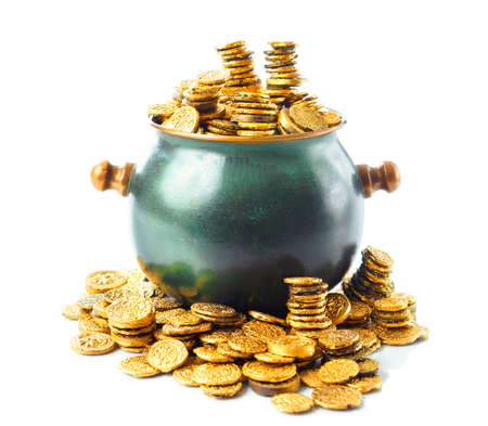 gold coins in a green pot isolated on whiteの写真素材