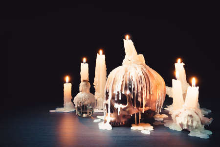 Creepy image of skull with a melting candle on top/ high contrast imageの写真素材