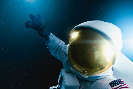 Astronaut floating in outer space , high contrast imageの写真素材