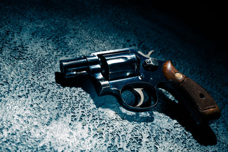 gun on the street floor, high contrast image