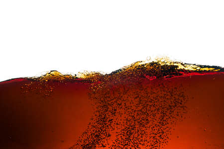 Side view background of refreshing cola flavored soda with bubbles isolated on whiteの写真素材