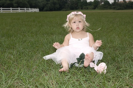 Beautiful little girl outdoors at the park の写真素材