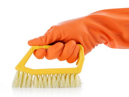 hand with orange glove cleaning with brushの写真素材