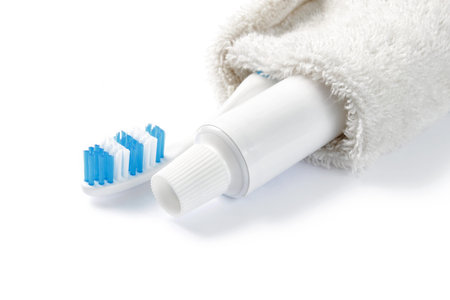 toothbrush and toothpaste inside the towelの写真素材