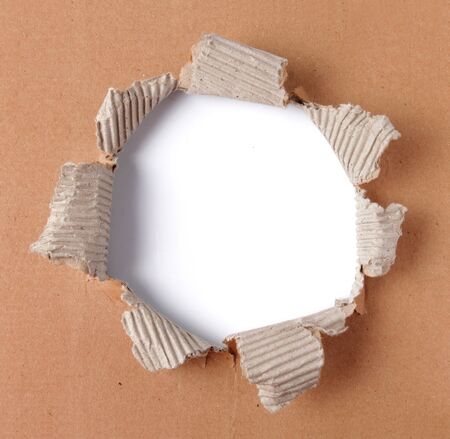 brown corrugated paper torn in the centerの写真素材