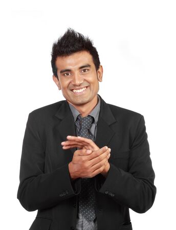 Young modern businessman clapping isolated on whiteの写真素材