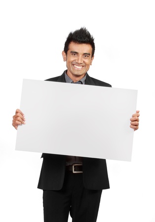 smiling Businessman holding a blank card isolated on white backgroundの写真素材