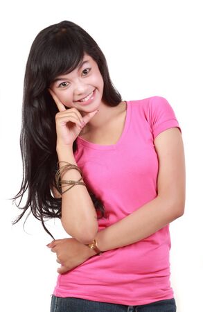 pretty young girl in pink smiling の写真素材