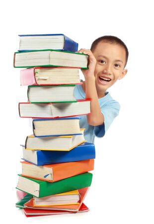 pile of book with lovely kid behind it. isolated over white backgroundの写真素材