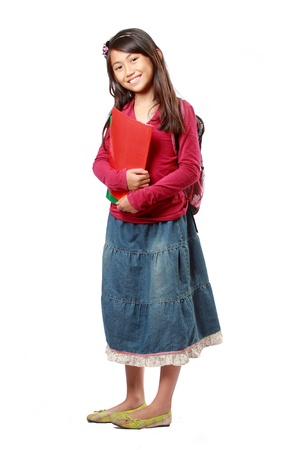 Happy little schoolgirl with books isolated on white backgroundの写真素材