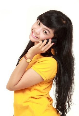 happy beautiful young girl with phoneの写真素材