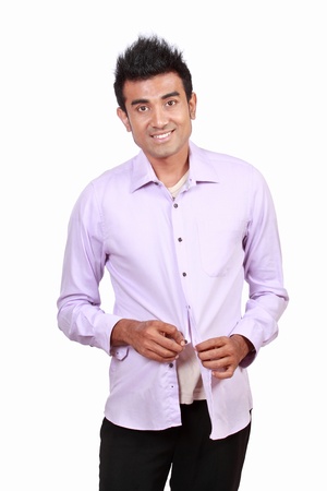 Portrait of attractive asian young man wearing cloth over white backgroundの写真素材