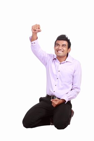 happy man celebrating his success isolated over a white backgroundの写真素材