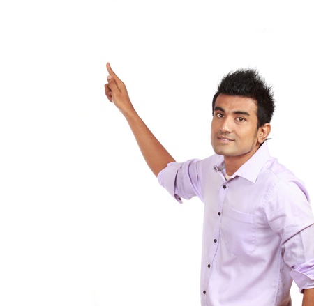 Smart young male business entrepreneur pointing at copyspace over white backgroundの写真素材