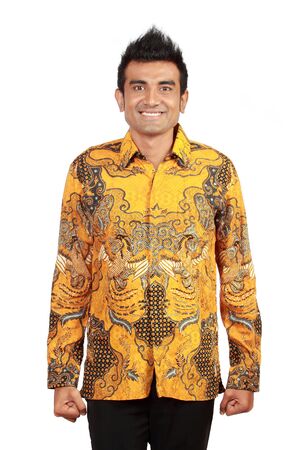 Portrait of smiling asian man wearing batikの写真素材