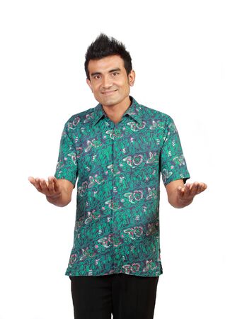 asian man presenting something over white backgroundの写真素材