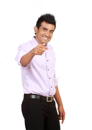 Attractive asian man pointing isolated on white backgroundの写真素材