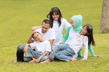 happy family having fun outdoorの写真素材