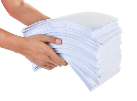 a stack of paper in his hand isolated on white background