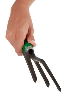 hand hold a fork for gardening . in isolated white backgroundの写真素材