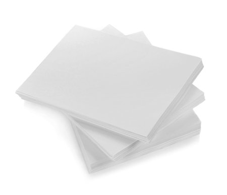 close up of stack of papers with curl on white background